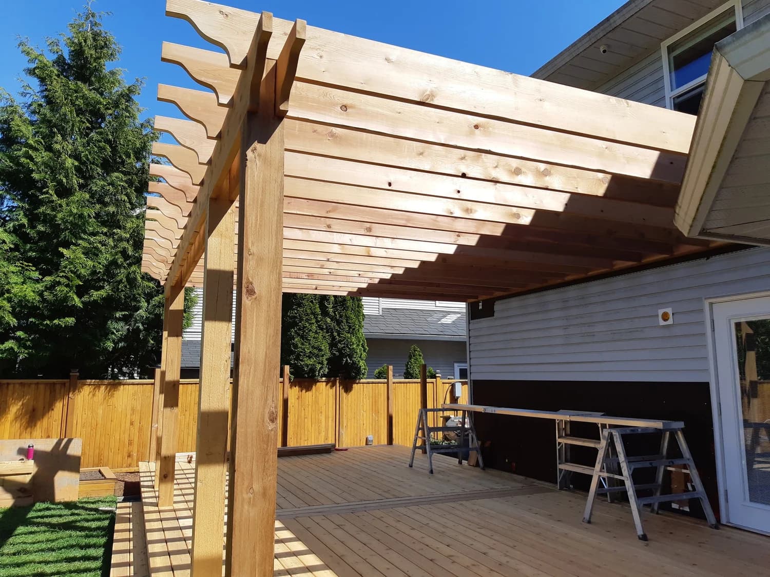 Full exterior reclad with new siding material by Tomron Construction in Abbotsford, BC